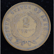 Obverse of 1865 United States Two Cent Piece showing shield and IN GOD WE TRUST motto, exact raw coin