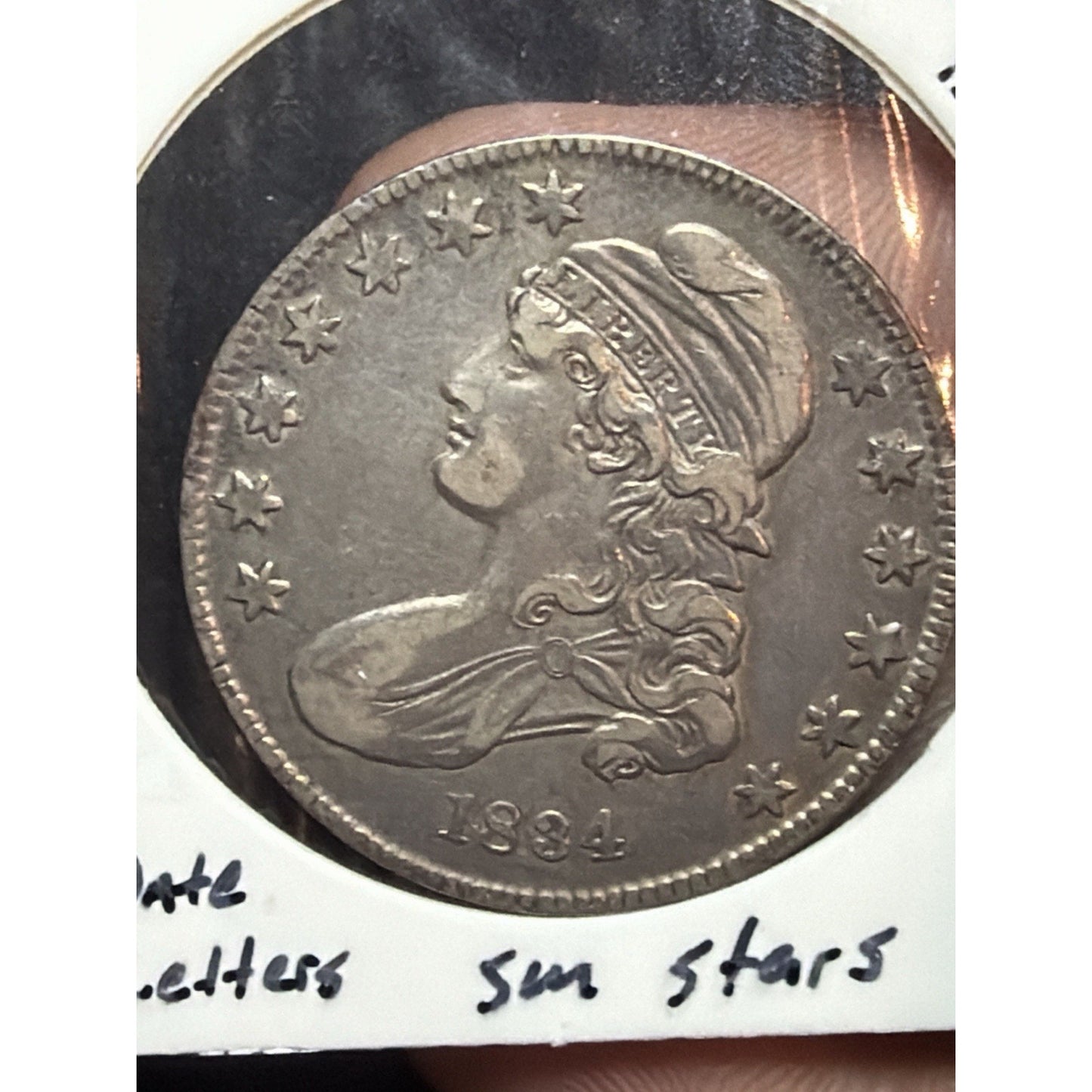 1834 Small Date Capped Bust Half Dollar toned obverse detail