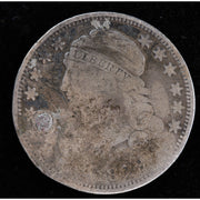 Obverse of holed 1829 Capped Bust dime showing Liberty portrait, heavy wear, and surface damage