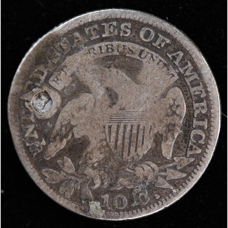 Reverse of holed 1829 Capped Bust dime showing eagle design, scratches, and circulated silver surfaces