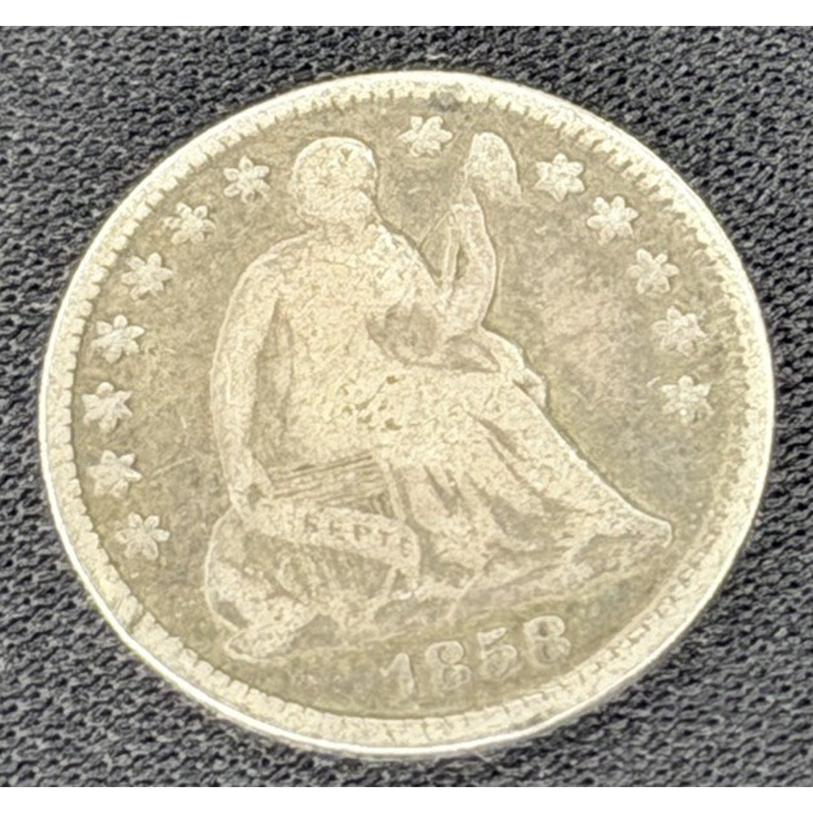 1858 Seated Liberty Half Dime obverse early silver coin