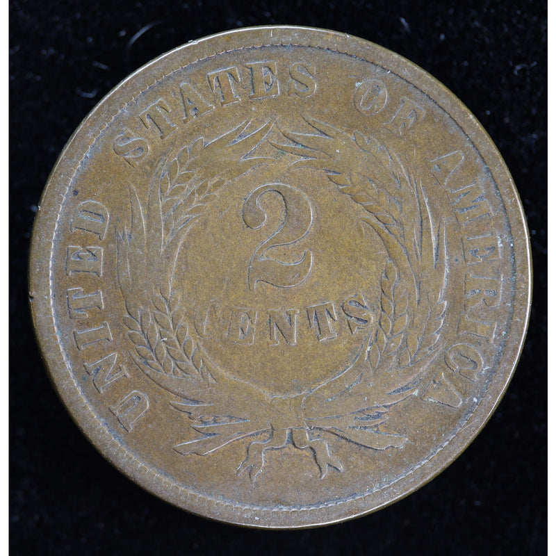 Obverse of 1864 United States Two Cent Piece showing shield and IN GOD WE TRUST motto, exact raw coin