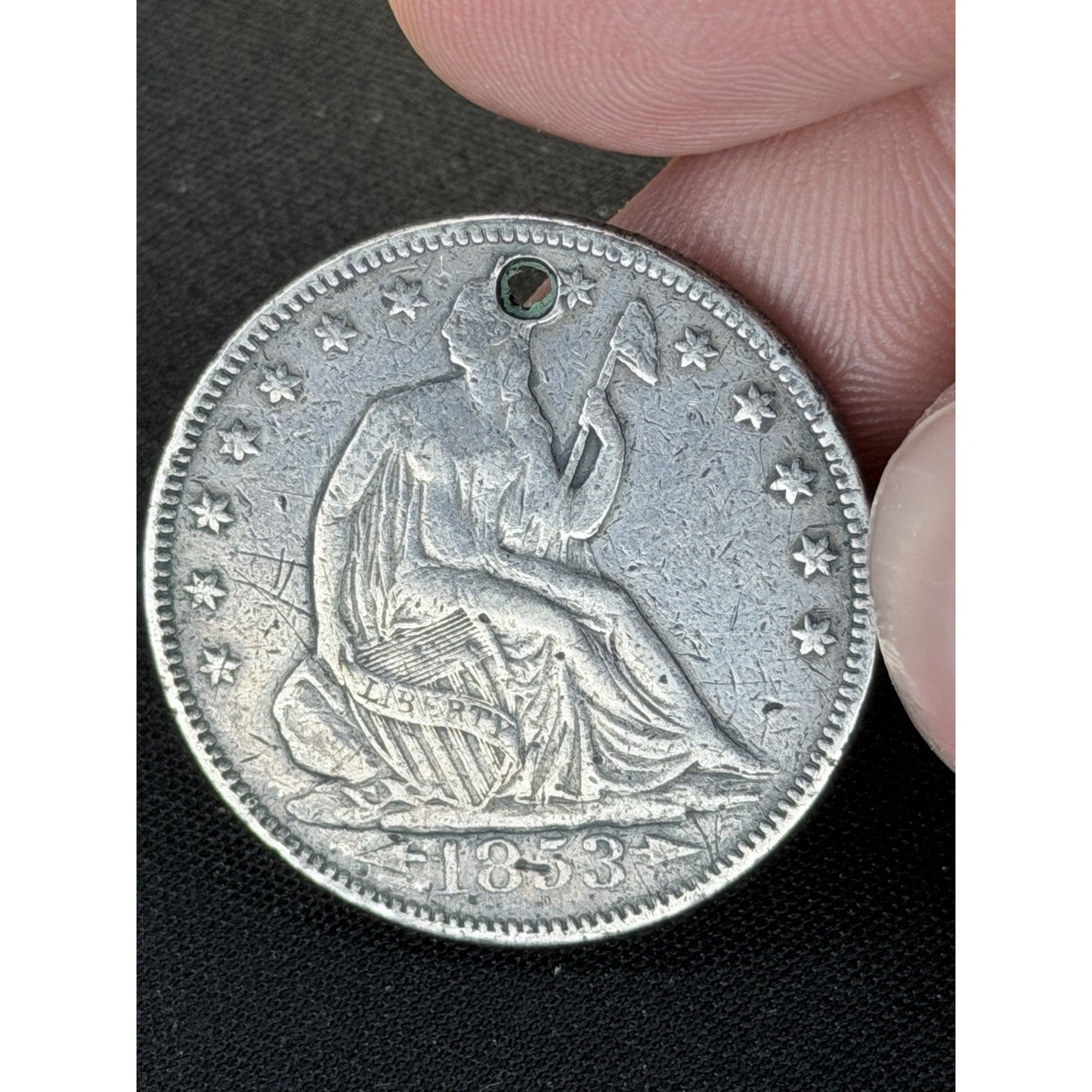 1853 Liberty Seated silver half dollar close up
