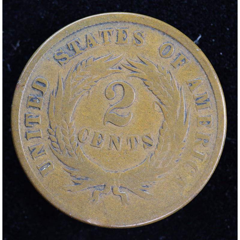 Obverse of 1865 United States Two Cent Piece showing shield and IN GOD WE TRUST motto, exact raw coin