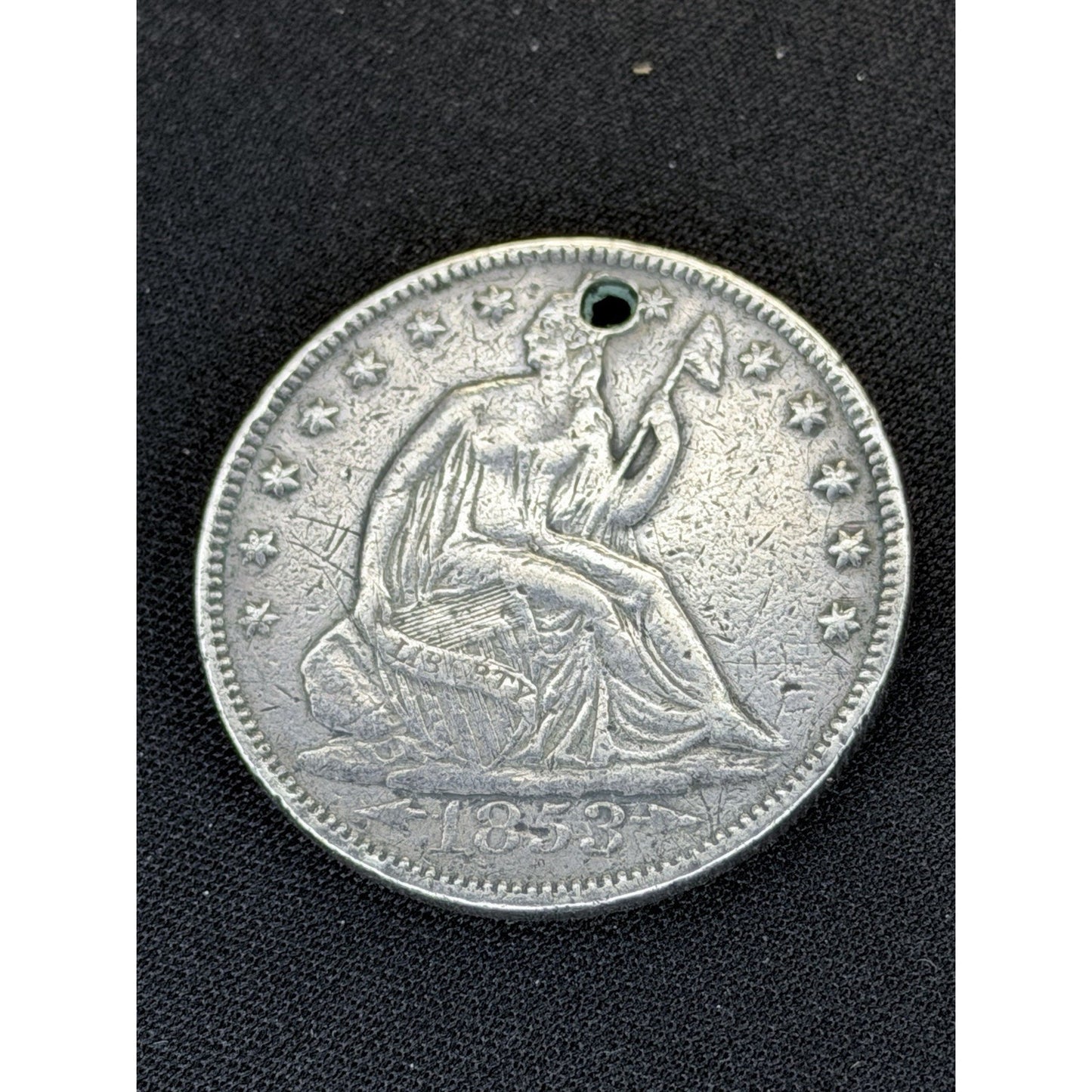 1853 Seated Liberty Half Dollar obverse holed detail
