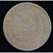 Obverse of 1864 United States Two Cent Piece showing shield and IN GOD WE TRUST motto, exact raw coin
