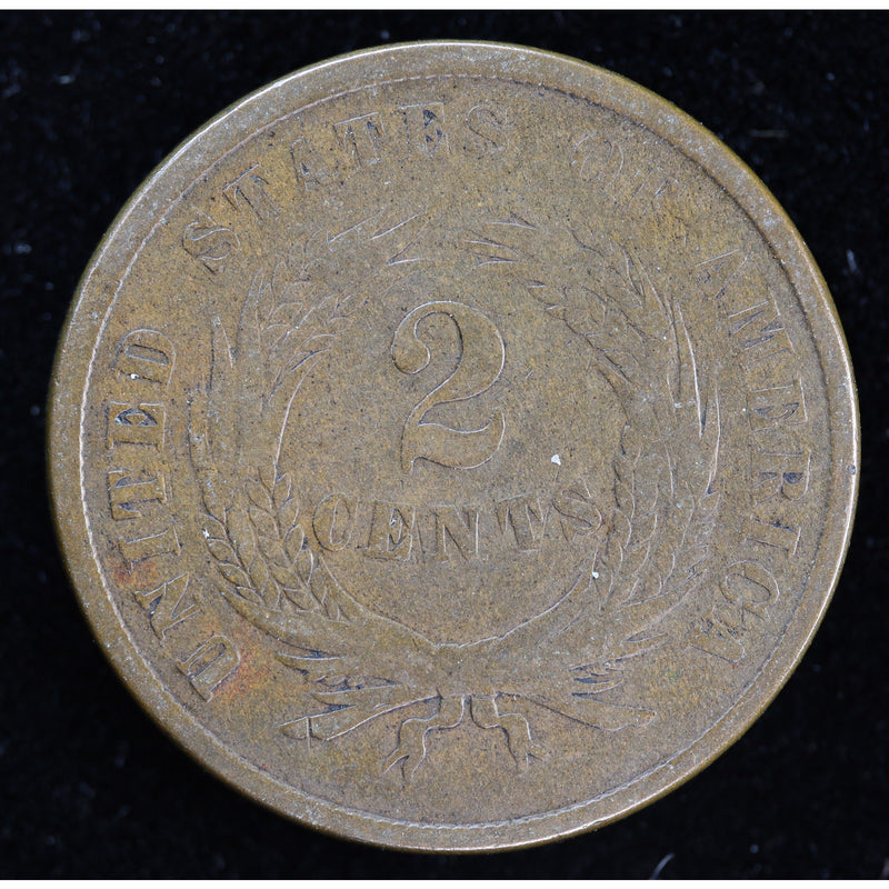 Obverse of 1864 United States Two Cent Piece showing shield and IN GOD WE TRUST motto, exact raw coin