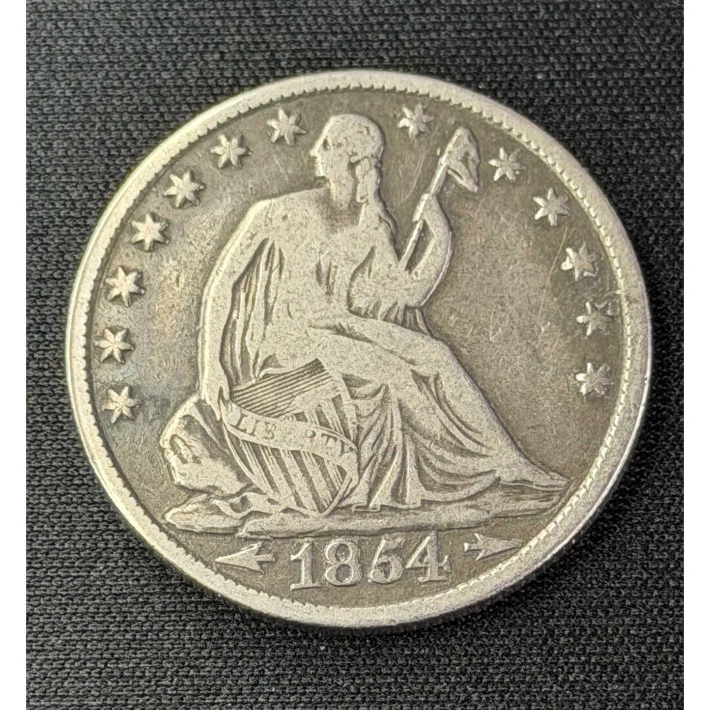 1854 O Arrows Seated Liberty Half Dollar obverse silver 50C coin