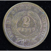 Obverse of dark-toned 1864 United States Two Cent Piece with shield and IN GOD WE TRUST motto