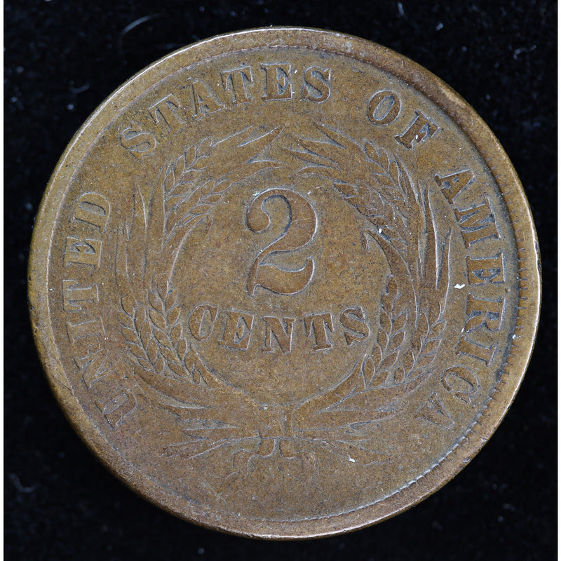 Obverse of 1864 United States Two Cent Piece showing shield and IN GOD WE TRUST motto, exact raw coin